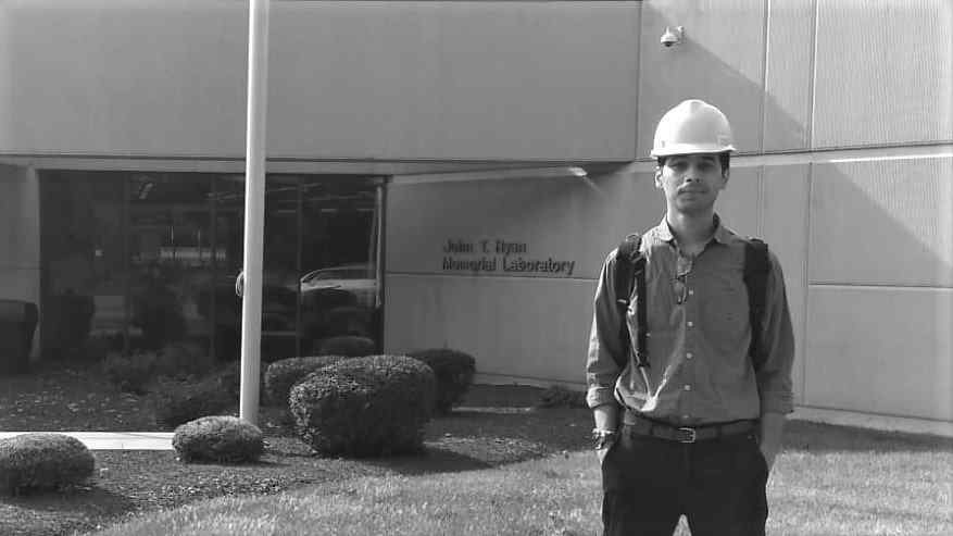 image of a person standing in front of the research lab at Mine Safety Appliances