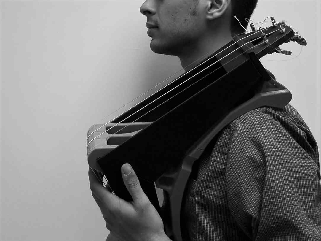 image showing a person with a novel musical instrument on shoulder